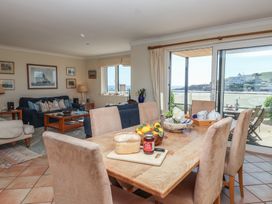 A living room with a dining area and views of the beach at 6 Burgh Island Bigbury-On-Sea