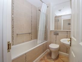 A bathroom with a bathtub, toilet, and sink at 6 Burgh Island, Bigbury-On-Sea