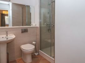A bathroom with sink, toilet, and shower at 6 Burgh Island in Bigbury-On-Sea
