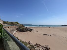 A beach view with rocks and water at 6 Burgh Island in Bigbury-On-Sea