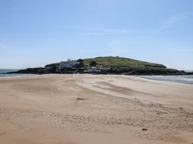 A beach view with ocean and hills at 6 Burgh Island in Bigbury-On-Sea