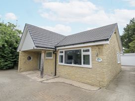 A house with a pathway and garage at Chillon in South Littleton near Honeybourne