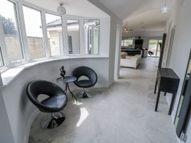 A seating area with two chairs and a table at Chillon South Littleton near Honeybourne