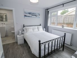 A bedroom with a bed and a window at Chillon South Littleton near Honeybourne