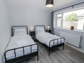 A bedroom with two beds and a window at Chillon in South Littleton near Honeybourne