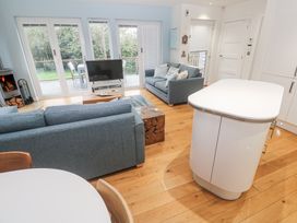 A living room with a sofa and television at The Black Barnacle in Portreath