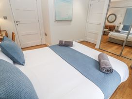 A bedroom with a bed and decor at The Black Barnacle in Portreath