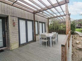 An outdoor area with a table and chairs at The Black Barnacle Portreath