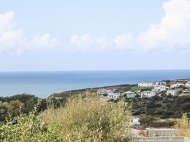 A coastal view with houses and the sea at The Black Barnacle in Portreath