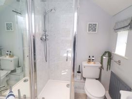 A bathroom with a shower and toilet at Sea Shore in Seahouses