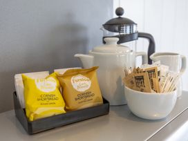 A kitchen setup with shortbread biscuits and tea items at Dahlia in Portreath