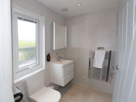 A bathroom with a sink and toilet at Dahlia Portreath