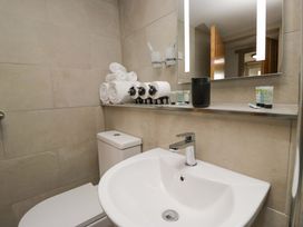 A bathroom with a sink and toilet at Yeat Stoup Cottage Cockermouth