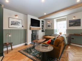 A living room with a sofa and coffee table at Hilltop Cottage in Conwy