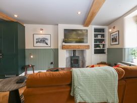 A living room with a sofa and coffee table at Hilltop Cottage in Conwy