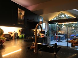 A kitchen with counter and appliances at Hilltop Cottage Conwy