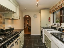 A kitchen with appliances and cabinets at Beech Brae Kendal