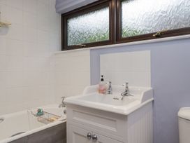 A bathroom with a sink, bathtub, and toilet at Beech Brae in Kendal