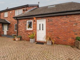 An outdoor area with a door and planters at The Nook