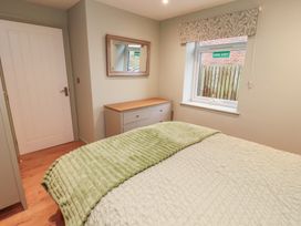 A bedroom with a bed and a window at The Nook in 
