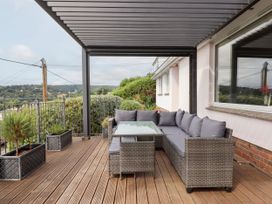 An outdoor seating area with a table at 15 Summerland Avenue, Dawlish