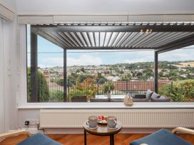 A sitting area with a view overlooking a village at 15 Summerland Avenue Dawlish