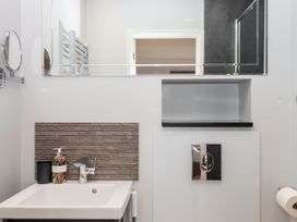 A bathroom with a sink and mirror at 15 Summerland Avenue, Dawlish