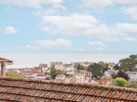 A view of houses and the sea at 15 Summerland Avenue Dawlish