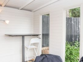 A snug area with a table and chair at 15 Summerland Avenue Dawlish