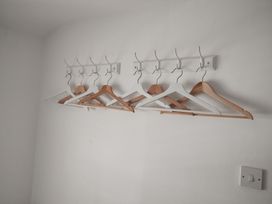 A wall display of clothes hangers at Llety in Beddgelert