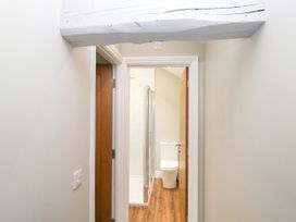 A bathroom with a shower enclosure and toilet at Swirral Edge Cottage in Glenridding