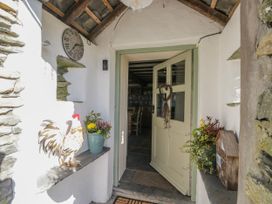 An entrance with a door and plants at High Ickenthwaite Farmhouse in Ulverston