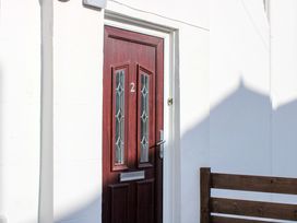 A door with number 2 at the entrance of 2 The Elms in Salcombe