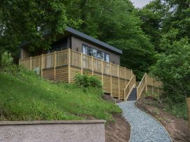 A house with decking and stairs in the outdoor area at Hodge Luxury Pod in Keswick