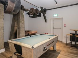 A recreation room with a pool table and foosball table at Hodge Luxury Pod in Keswick