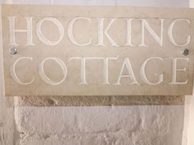 A plaque displaying the name Hocking Cottage