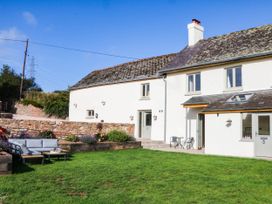 A house with garden furniture at Higher Weekaborough Farm in Coombe Fishacre near Ipplepen