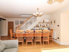A dining room with a table and chairs at Higher Weekaborough Farm, Coombe Fishacre near Ipplepen