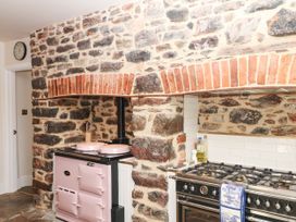 A kitchen with a stove and oven at Higher Weekaborough Farm in Coombe Fishacre near Ipplepen