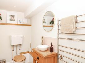 A bathroom with a sink and toilet at Higher Weekaborough Farm near Coombe Fishacre near Ipplepen
