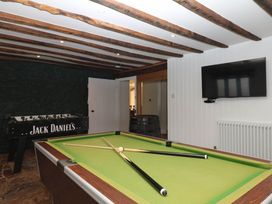 A games room with a pool table and foosball table at Higher Weekaborough Farm near Coombe Fishacre near Ipplepen