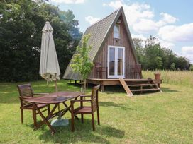 A-frame house with table and chairs in a garden at A-frame in Monewden near Otley, Suffolk