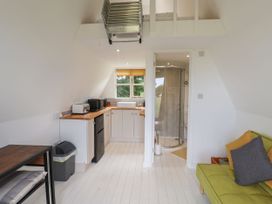 A kitchen with a sofa and shower at A-frame in Monewden near Otley, Suffolk