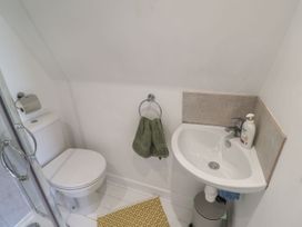 A bathroom with a toilet and sink at A-frame in Monewden near Otley, Suffolk