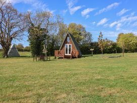 A-frame building with deck and chairs in outdoor area at A-frame in Monewden near Otley, Suffolk