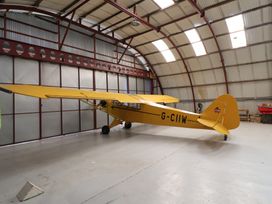 An airplane inside a hangar at A-frame in Monewden near Otley, Suffolk