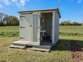 A shed with a toilet and sink at A-frame in Monewden near Otley, Suffolk
