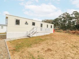 A mobile home with steps and railing on a plot of land near trees at 31A Foxburrow Hang in Fritton near Belton Norfolk