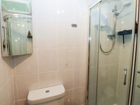 A bathroom featuring a shower and a toilet at North Sands Beadnell