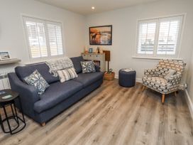 A living room with a sofa and chair at North Sands Beadnell